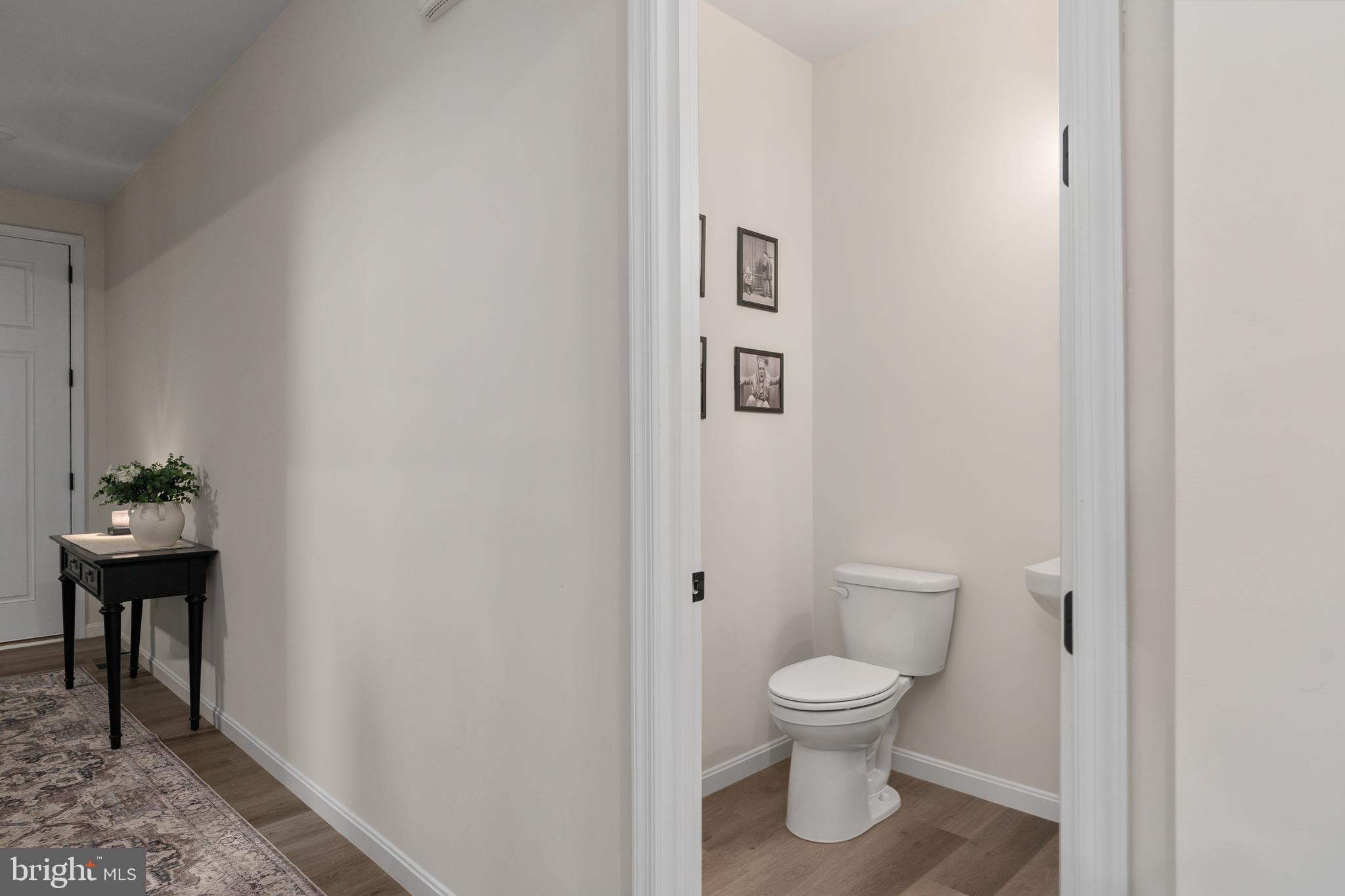 35514 Aspen Way Locust Grove, VA 22508 - Photo 8 of 56 a bathroom with a toilet a sink and a window