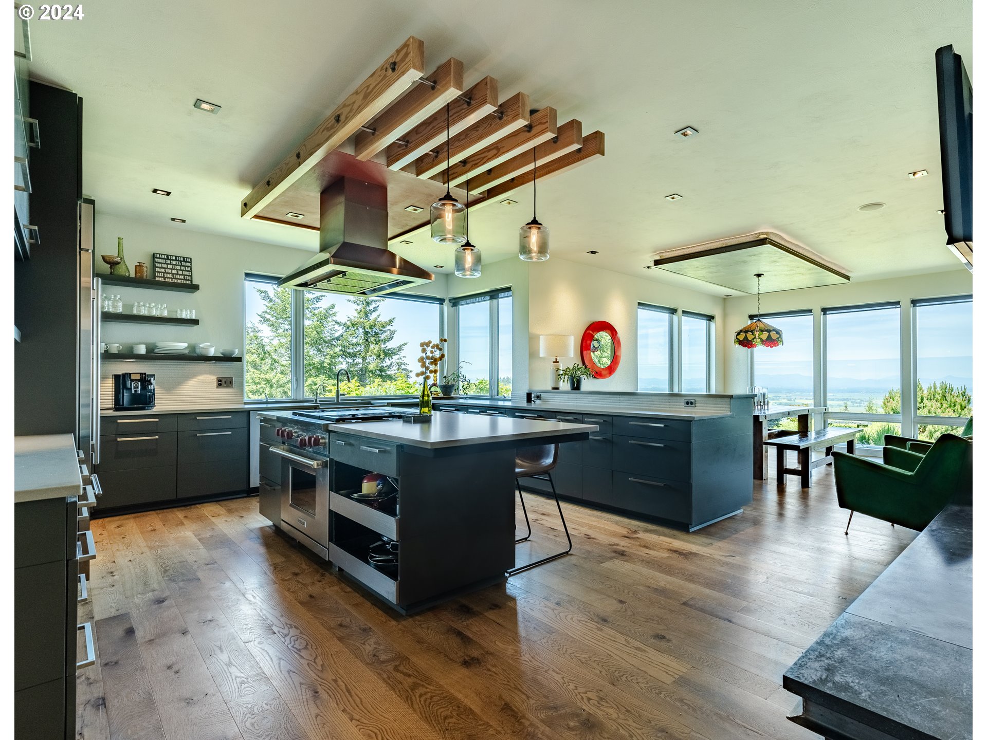90535 Coburghills Drive Eugene, OR 97408 - Photo 12 of 48 a kitchen with stainless steel appliances granite countertop a stove a sink and a refrigerator