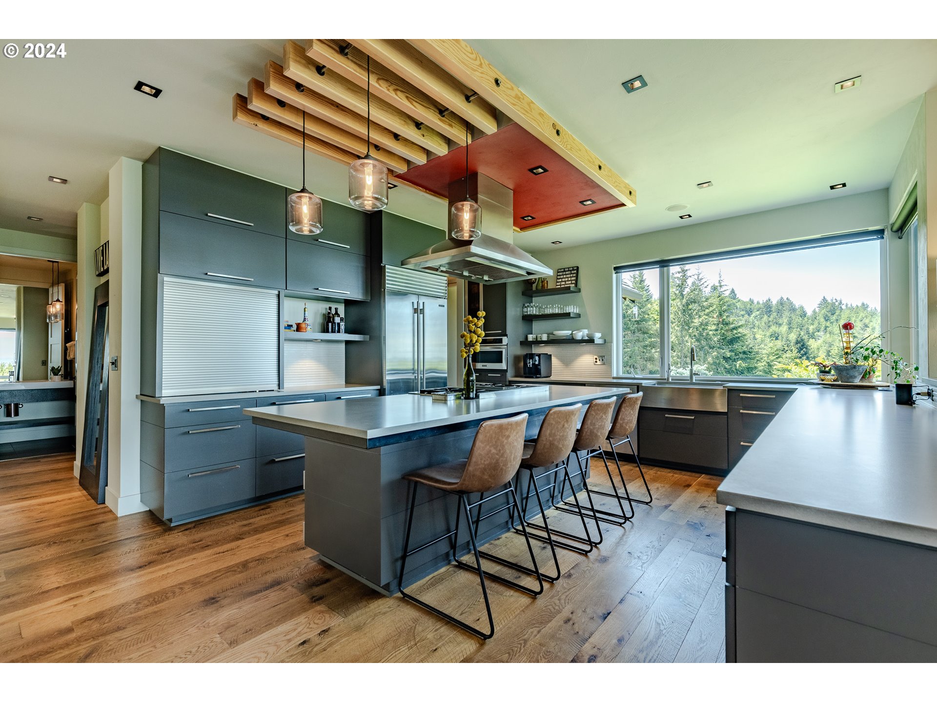 90535 Coburghills Drive Eugene, OR 97408 - Photo 13 of 48 a kitchen with stainless steel appliances granite countertop a kitchen island a stove and a refrigerator
