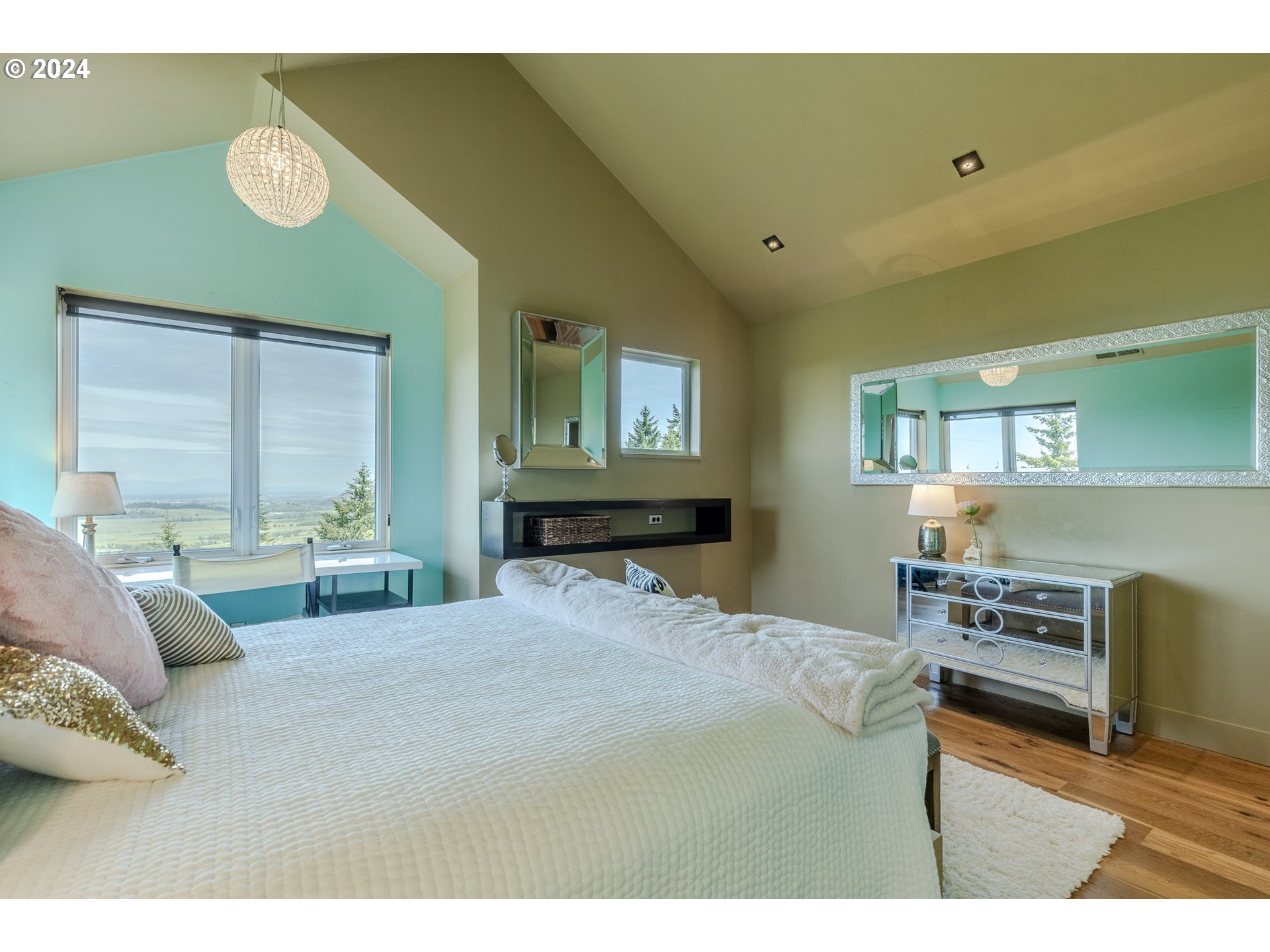 90535 Coburghills Drive Eugene, OR 97408 - Photo 28 of 48 a bedroom with a bed a table and chair