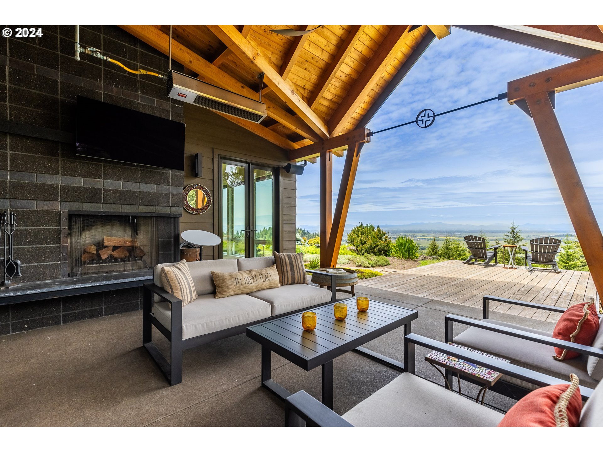 90535 Coburghills Drive Eugene, OR 97408 - Photo 38 of 48 a living room with furniture a fireplace and a table