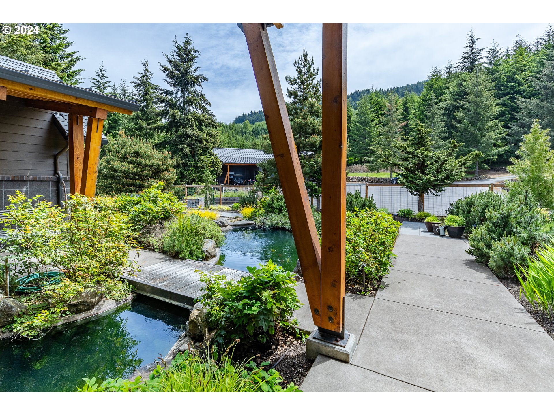 90535 Coburghills Drive Eugene, OR 97408 - Photo 40 of 48 a view of a backyard with plants