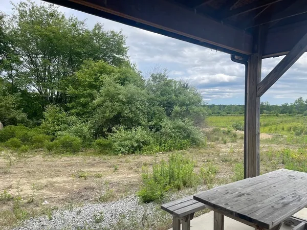 a view of a balcony with lake view and mountain view