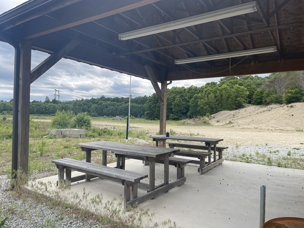 1 Elm Street Halifax, MA 02338 - Photo 12 of 26 a view of a roof deck with couches and wooden floor