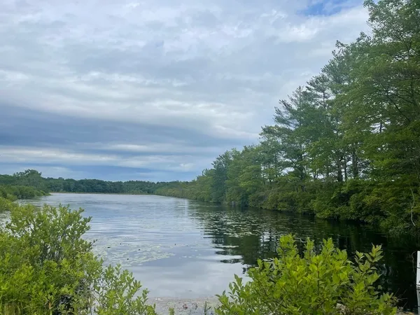 a view of a lake with a big yard