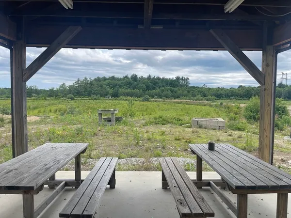 a view of a chairs and table in the balcony