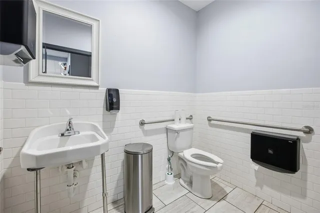 a bed room with lots of furniture and baby crib