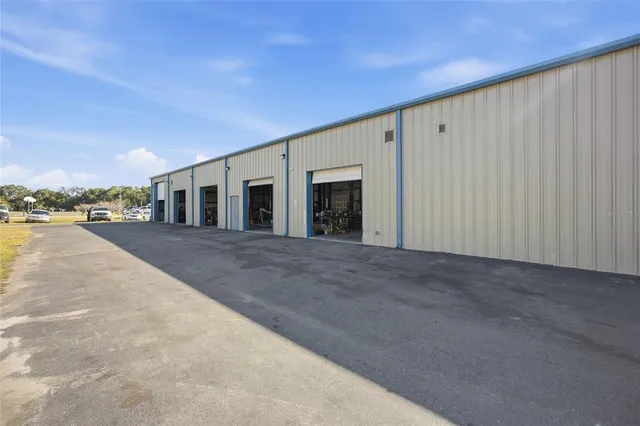 a view of a big room with an trees and fence