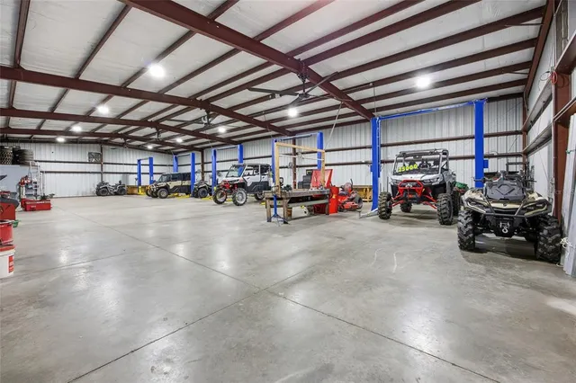 a view of a swimming pool with a patio and a yard