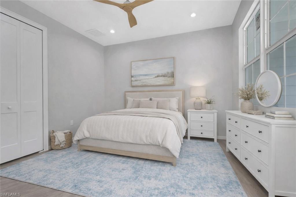 3500 Croton Road, Unit 102 Naples, FL 34104 - Photo 16 of 27 a bedroom with a bed and window