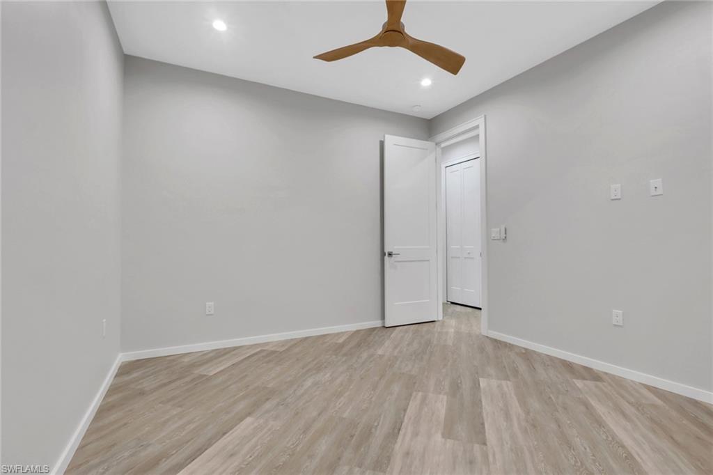 3500 Croton Road, Unit 102 Naples, FL 34104 - Photo 18 of 27 wooden floor in an empty room