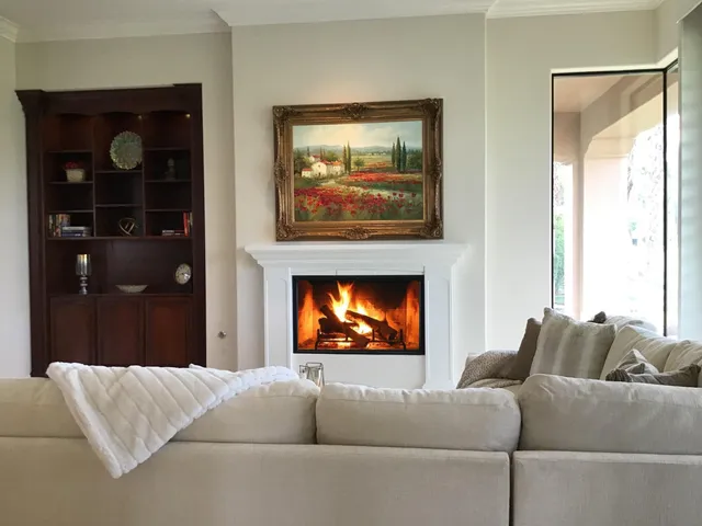 a living room with furniture and a fireplace