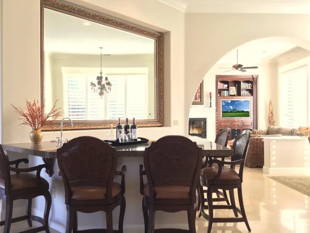 a dining room with furniture and window