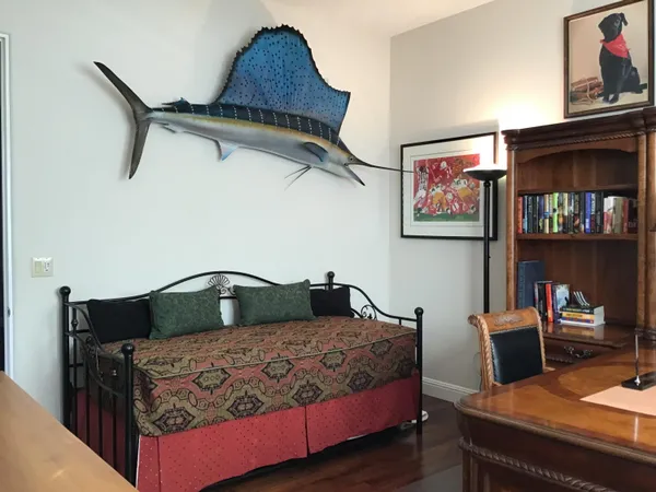 a bedroom with a bed and dresser