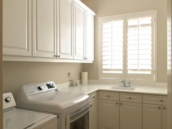 a kitchen with sink cabinets and window