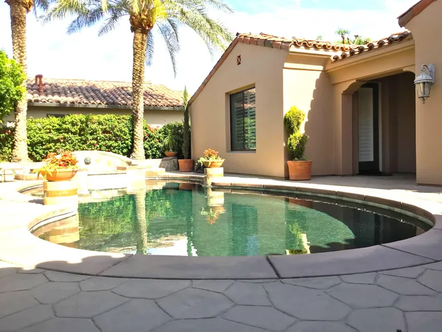 a view of a swimming pool with a lounge chair