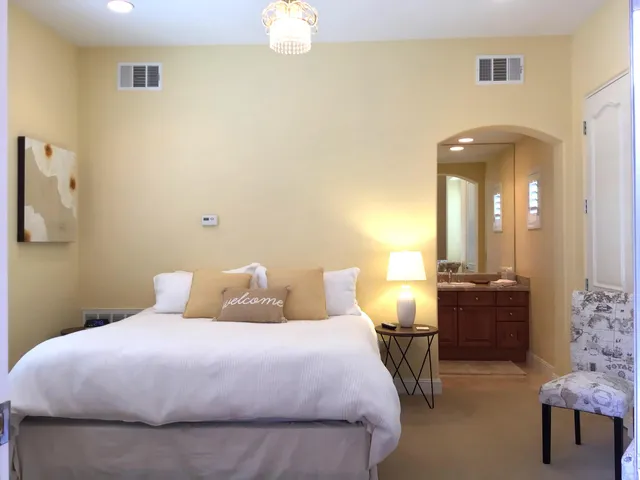 a bedroom with a bed and window