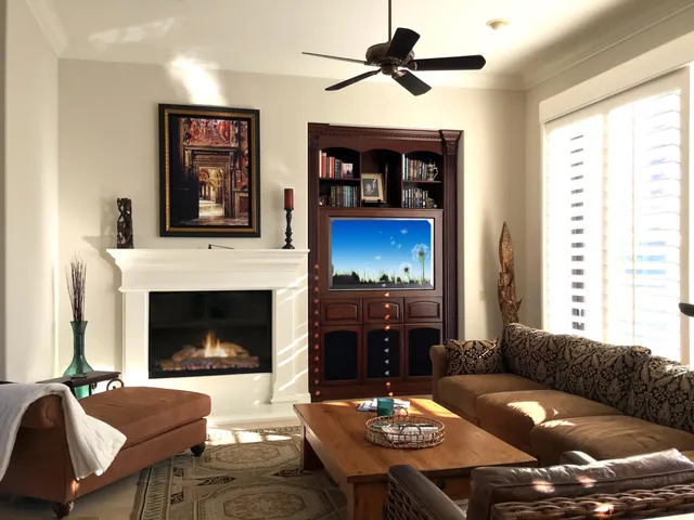 a living room with furniture and a fireplace