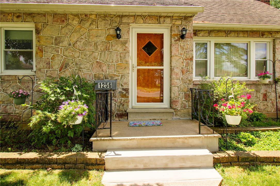 1256 Ridge Avenue Whitehall, PA 18052 - Photo 2 of 43 A charming stone facade with manicured landscaping frames the inviting entryway.