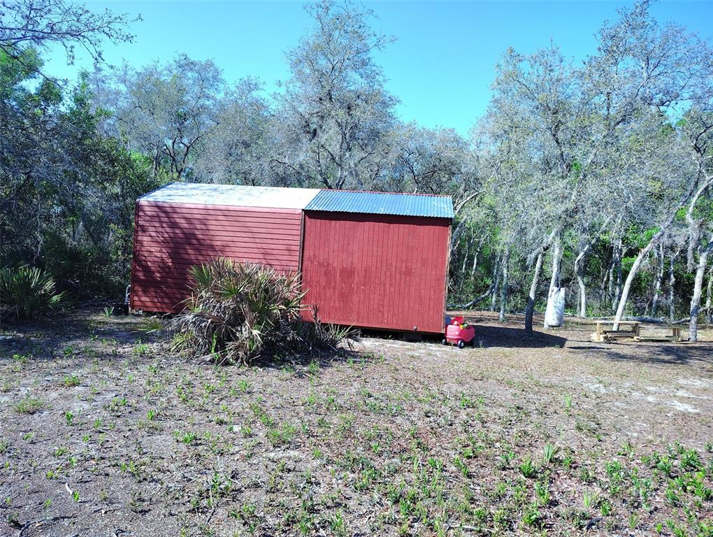 1873 West Foxglove Road Avon Park, FL 33825 - Photo 8 of 14 a view of a house with backyard and trees