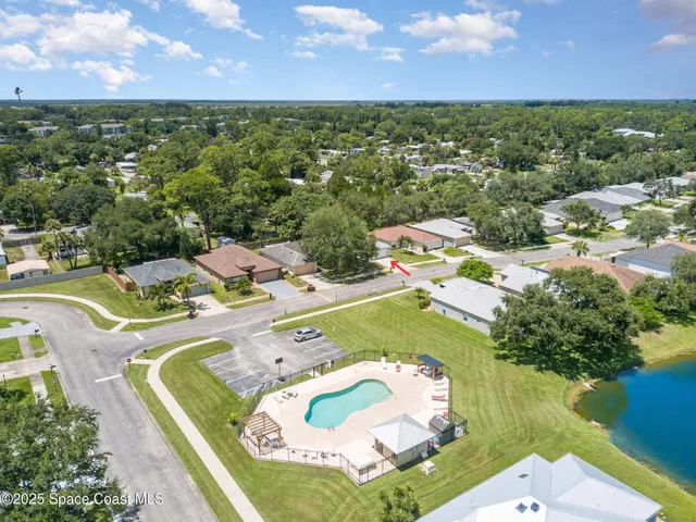 a view of a swimming pool with a yard