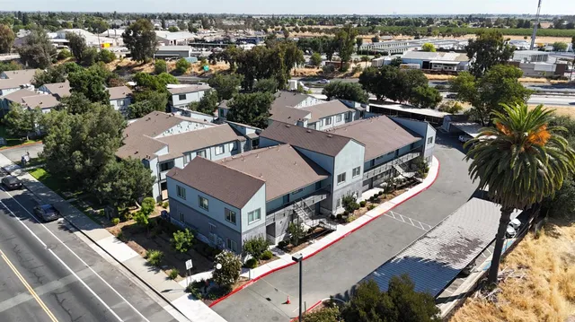 an aerial view of a house with a yard