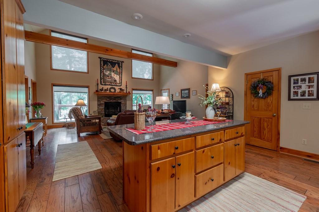 636 Kings Gap Road Hamilton, GA 31811 - Photo 17 of 63 a living room with stainless steel appliances granite countertop furniture wooden floor and a fireplace