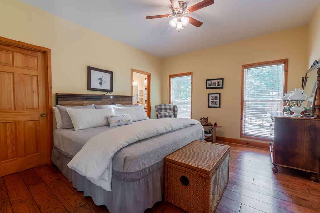 636 Kings Gap Road Hamilton, GA 31811 - Photo 23 of 63 a bedroom with a bed and a chandelier