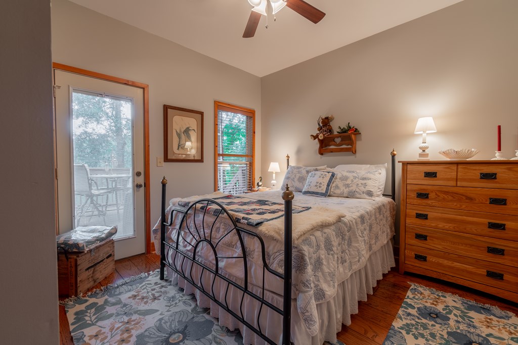 636 Kings Gap Road Hamilton, GA 31811 - Photo 34 of 63 a bedroom with a bed and a chandelier