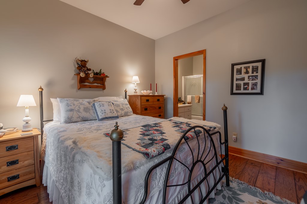 636 Kings Gap Road Hamilton, GA 31811 - Photo 35 of 63 a view of a bedroom with a bed and wooden floor