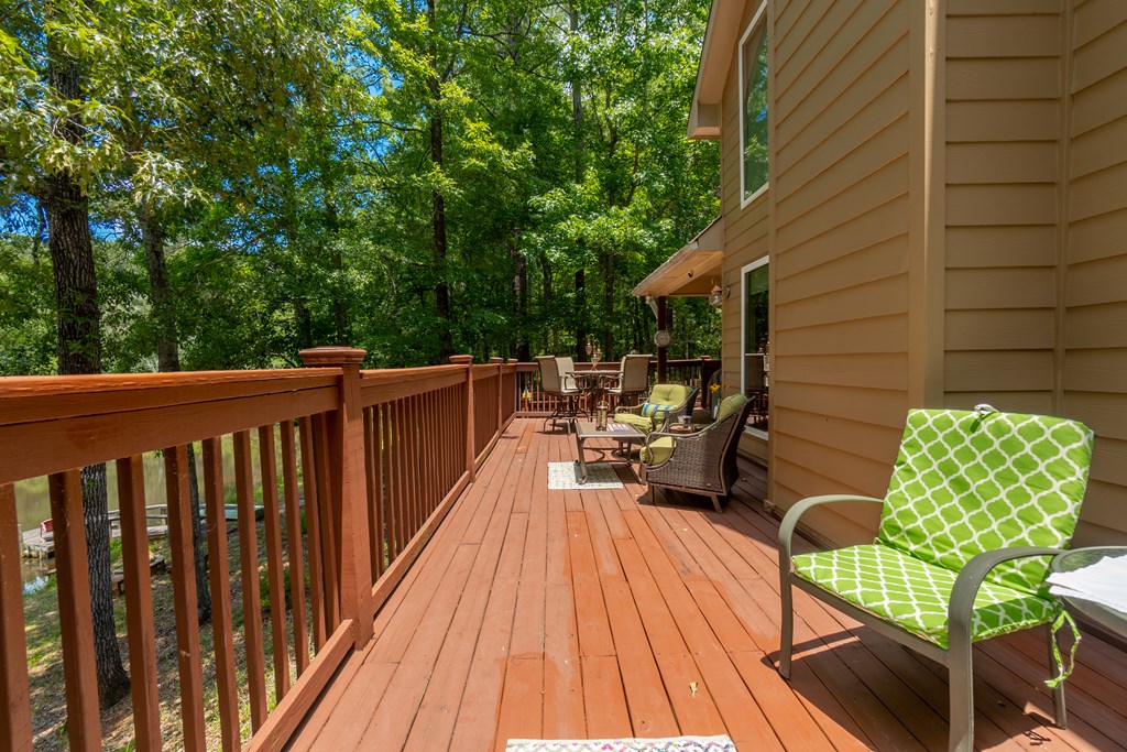 636 Kings Gap Road Hamilton, GA 31811 - Photo 38 of 63 a view of balcony with chairs and wooden fence