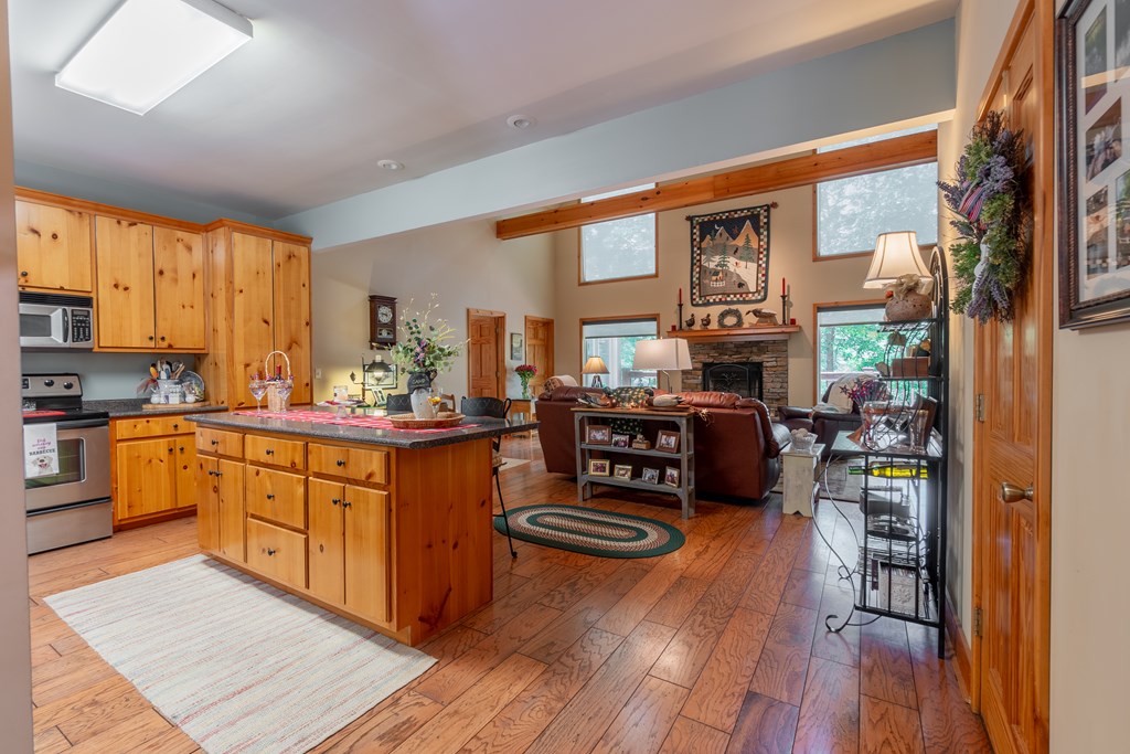 636 Kings Gap Road Hamilton, GA 31811 - Photo 10 of 63 a kitchen with lots of counter top space and wooden floor