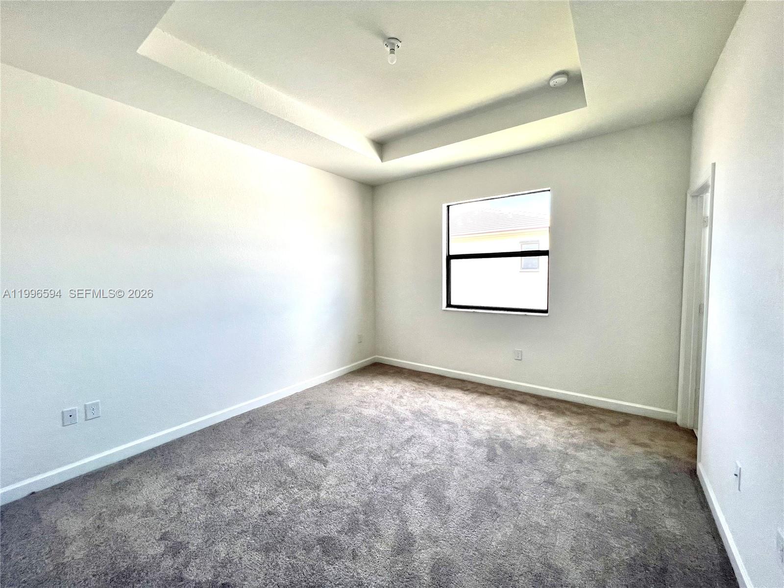 23373 Southwest 129th Path, Unit 23373 Homestead, FL 33032 - Photo 16 of 18 an empty room with windows