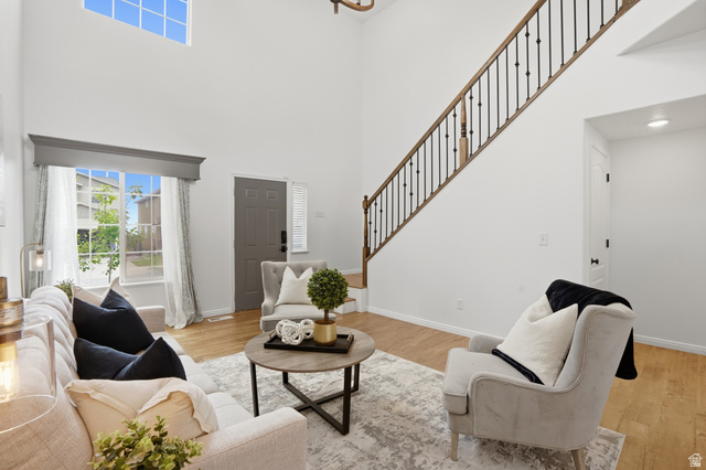2007 Fielding Hill Lane Draper, UT 84020 - Photo 7 of 83 Two-story living area featuring a prominent staircase with dark metal balusters and wood handrails