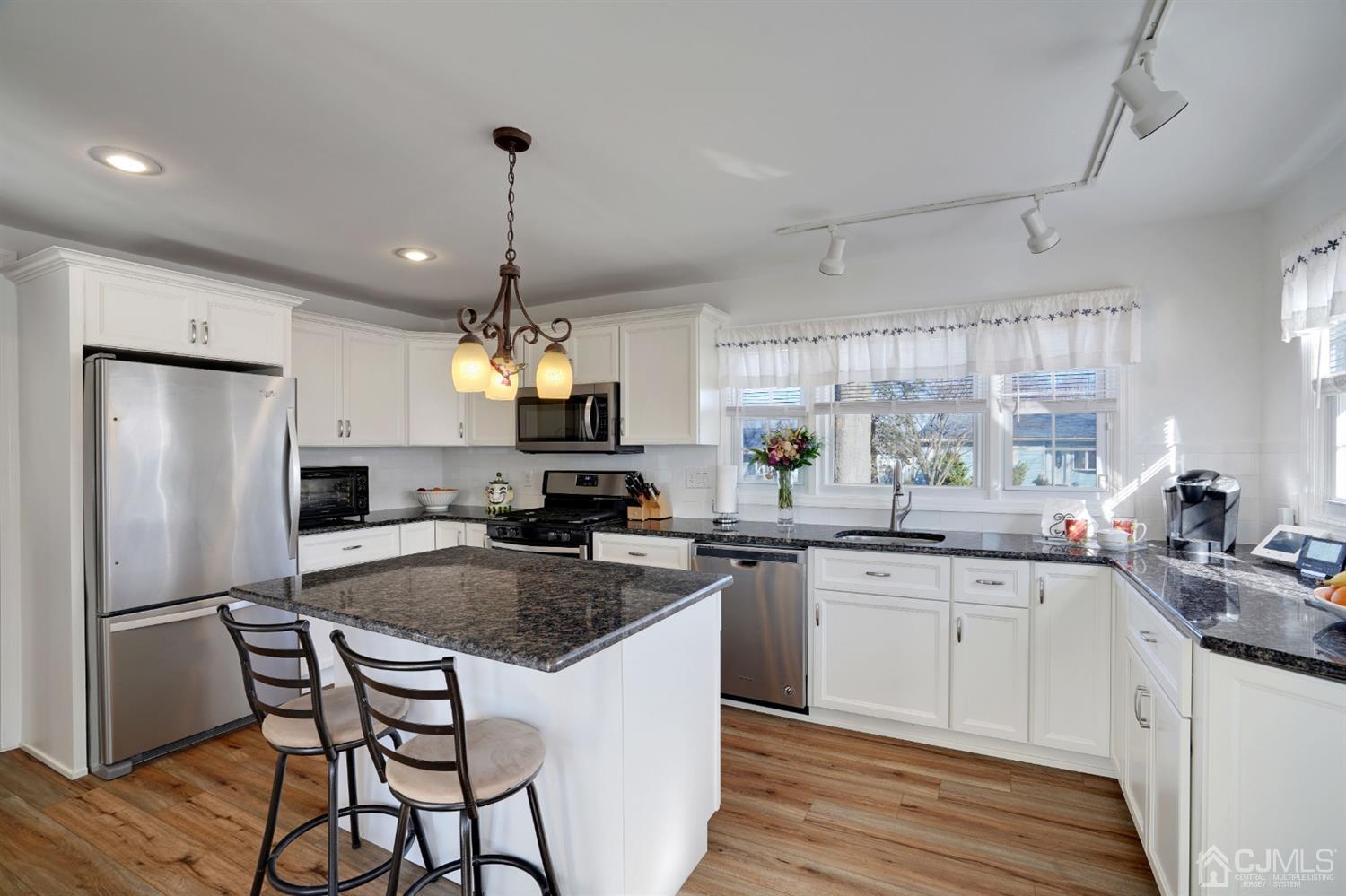 17 Bucknell Road Old Bridge, NJ 08859 - Photo 13 of 28 a kitchen with granite countertop a sink stove and refrigerator