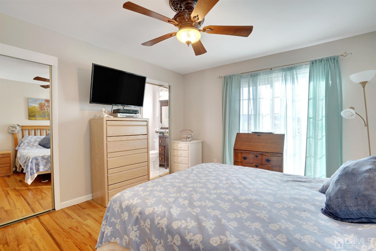 17 Bucknell Road Old Bridge, NJ 08859 - Photo 18 of 28 a bedroom with a bed and a flat screen tv