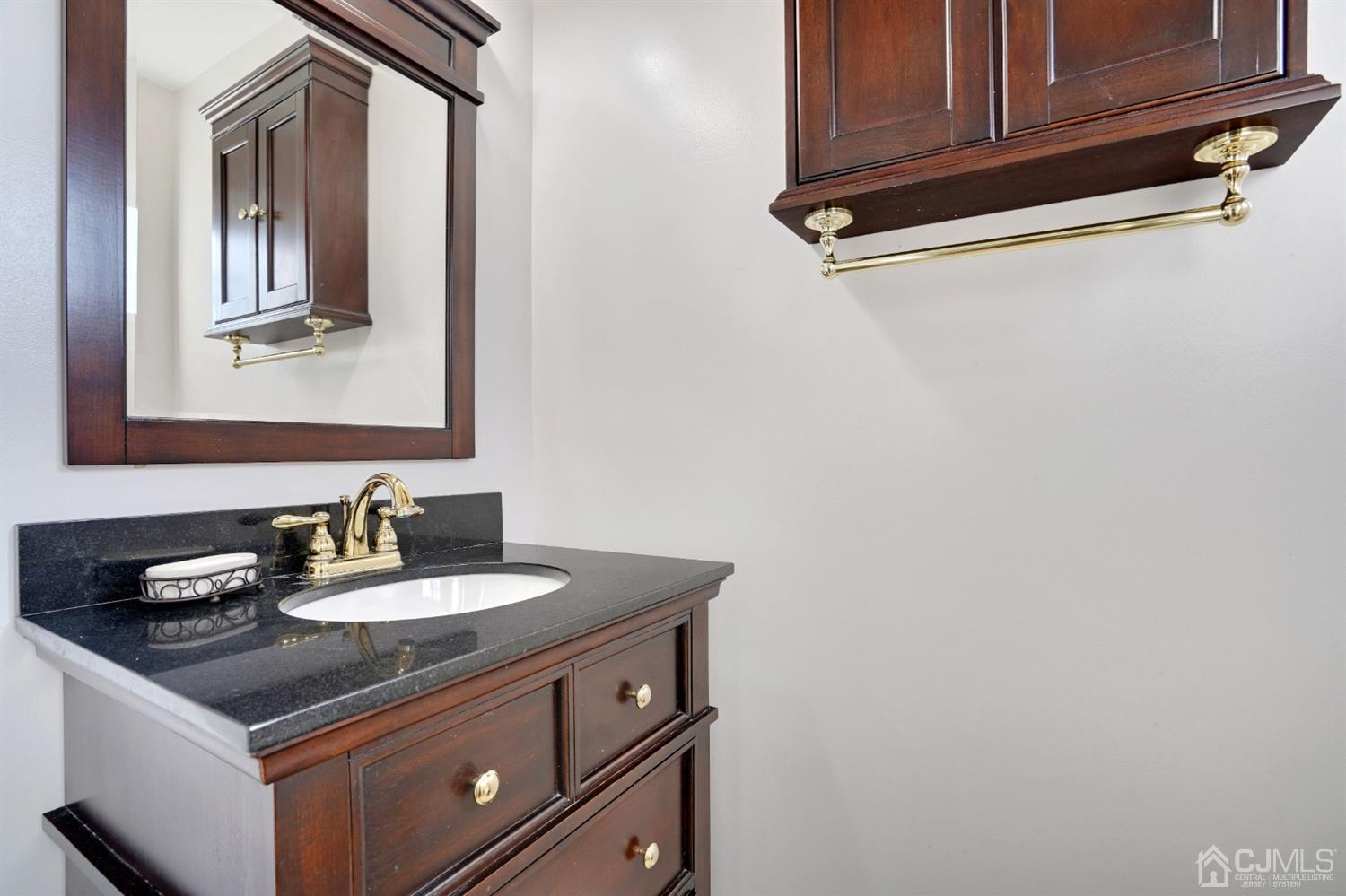 17 Bucknell Road Old Bridge, NJ 08859 - Photo 19 of 28 a bathroom with a sink and a mirror