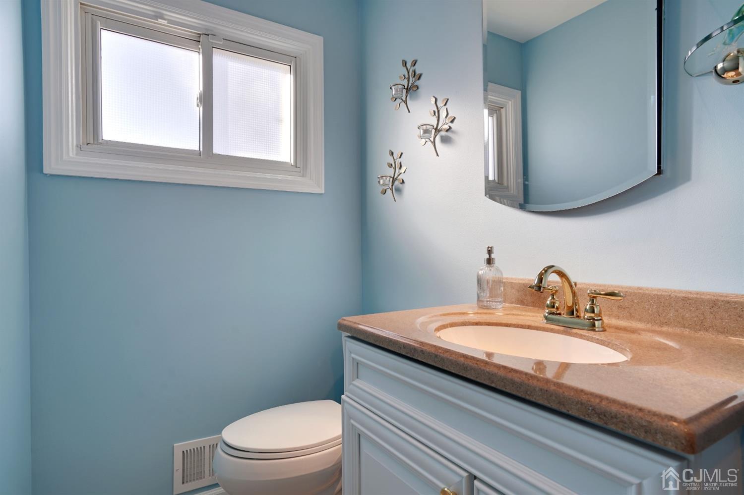 17 Bucknell Road Old Bridge, NJ 08859 - Photo 21 of 28 a bathroom with a granite countertop toilet a sink and mirror