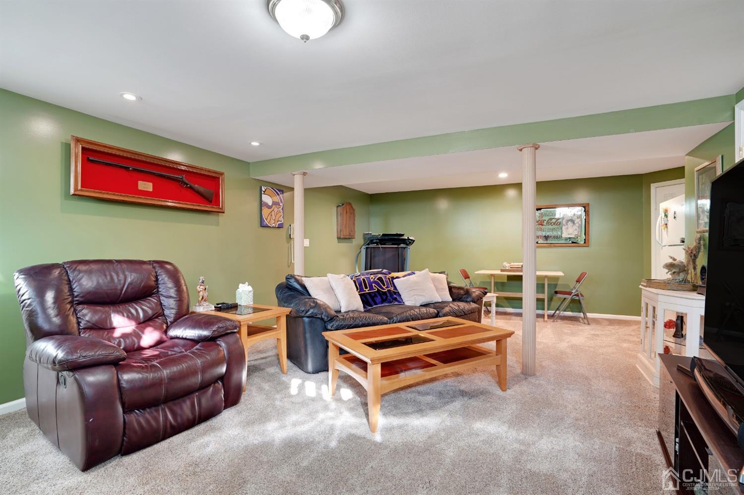 17 Bucknell Road Old Bridge, NJ 08859 - Photo 22 of 28 a living room with furniture and a flat screen tv