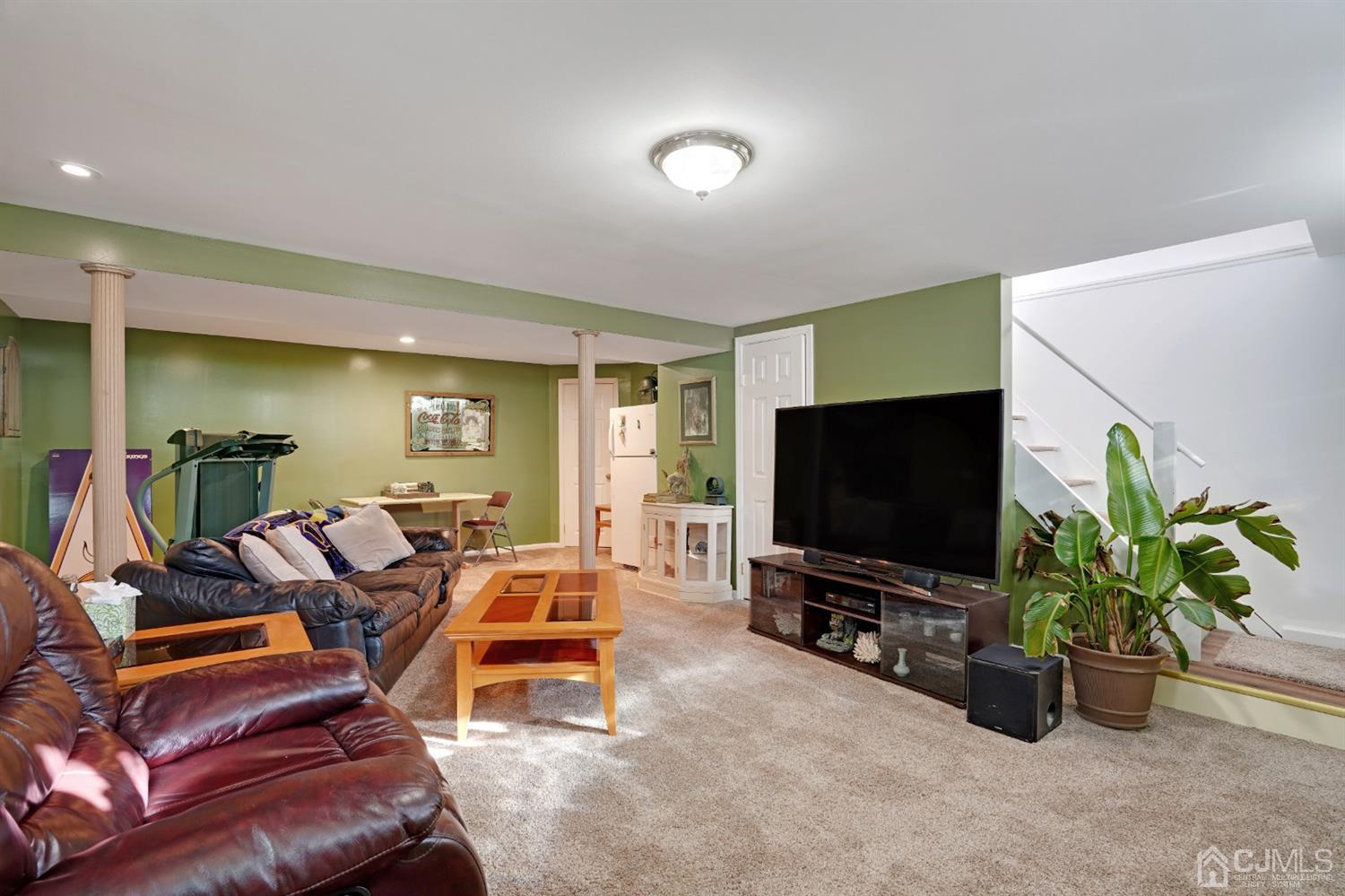 17 Bucknell Road Old Bridge, NJ 08859 - Photo 23 of 28 a living room with furniture and a flat screen tv