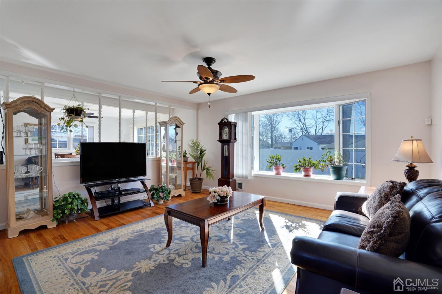 17 Bucknell Road Old Bridge, NJ 08859 - Photo 7 of 28 a living room with furniture a flat screen tv and a large window