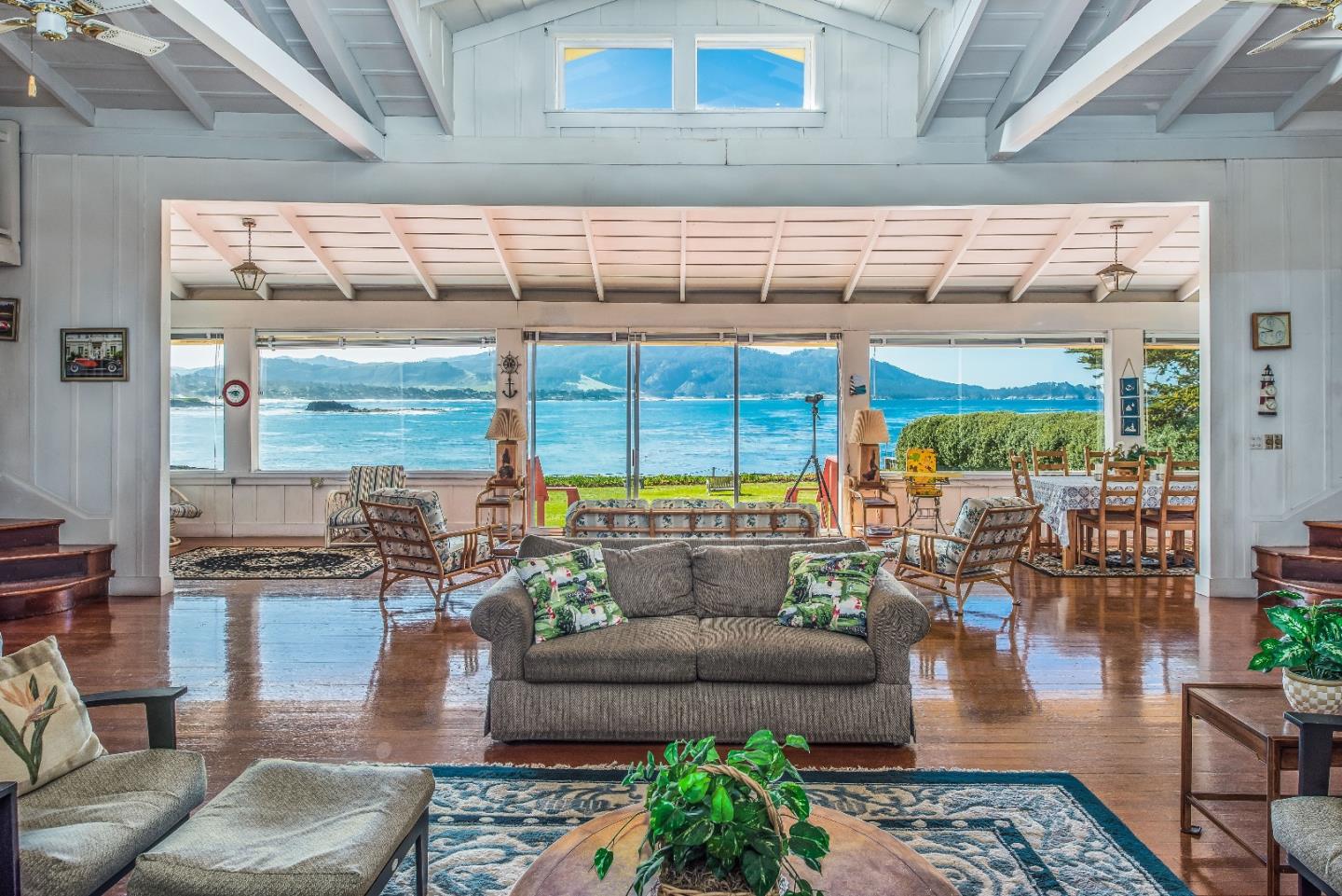 1498 Cypress Drive Pebble Beach, CA 93953 - Photo 2 of 15 a living room with couch and a large window