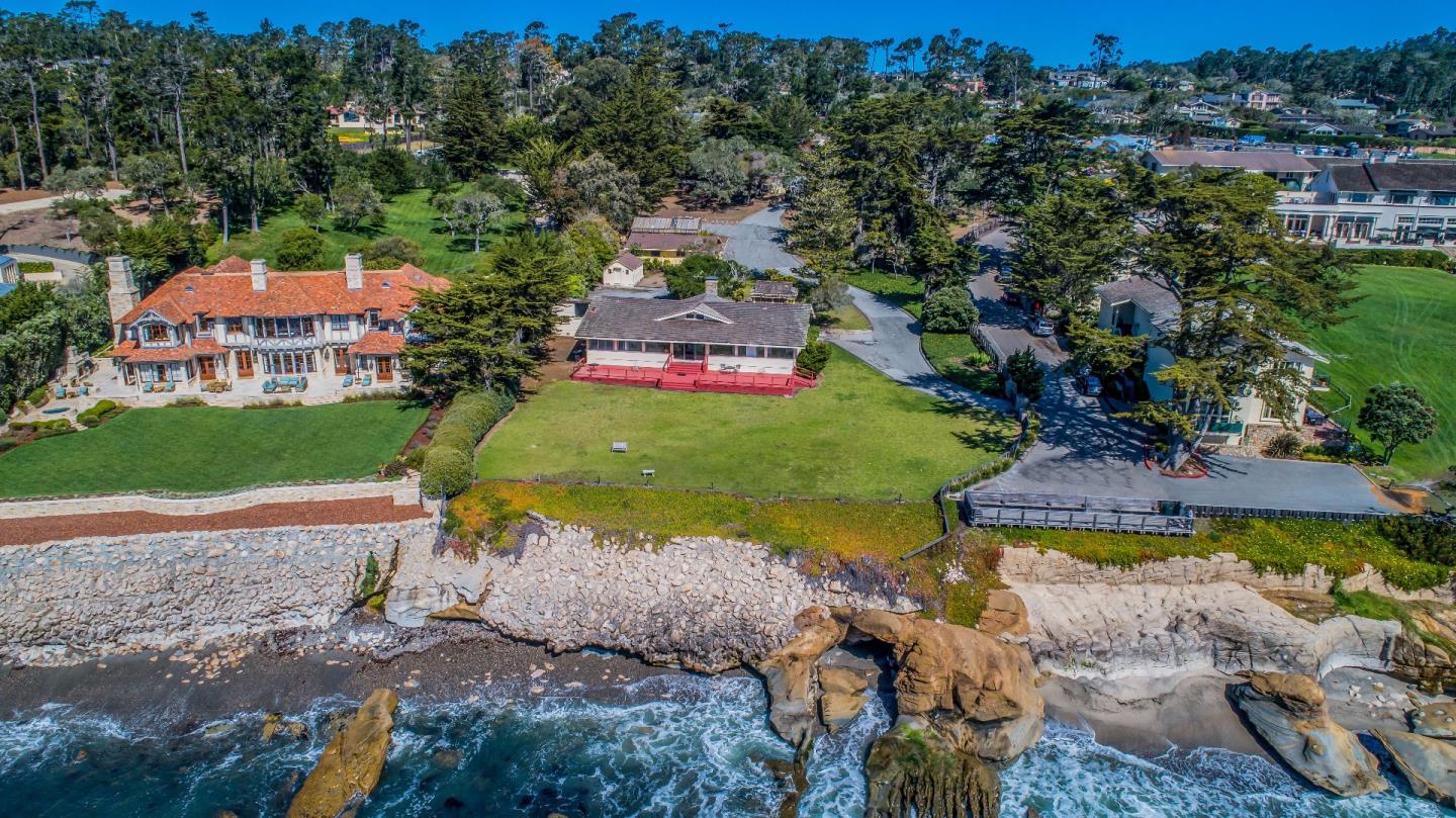 1498 Cypress Drive Pebble Beach, CA 93953 - Photo 8 of 15 an aerial view of a house with a garden and swimming pool