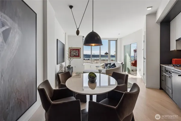 a view of a dining room with furniture and wooden floor