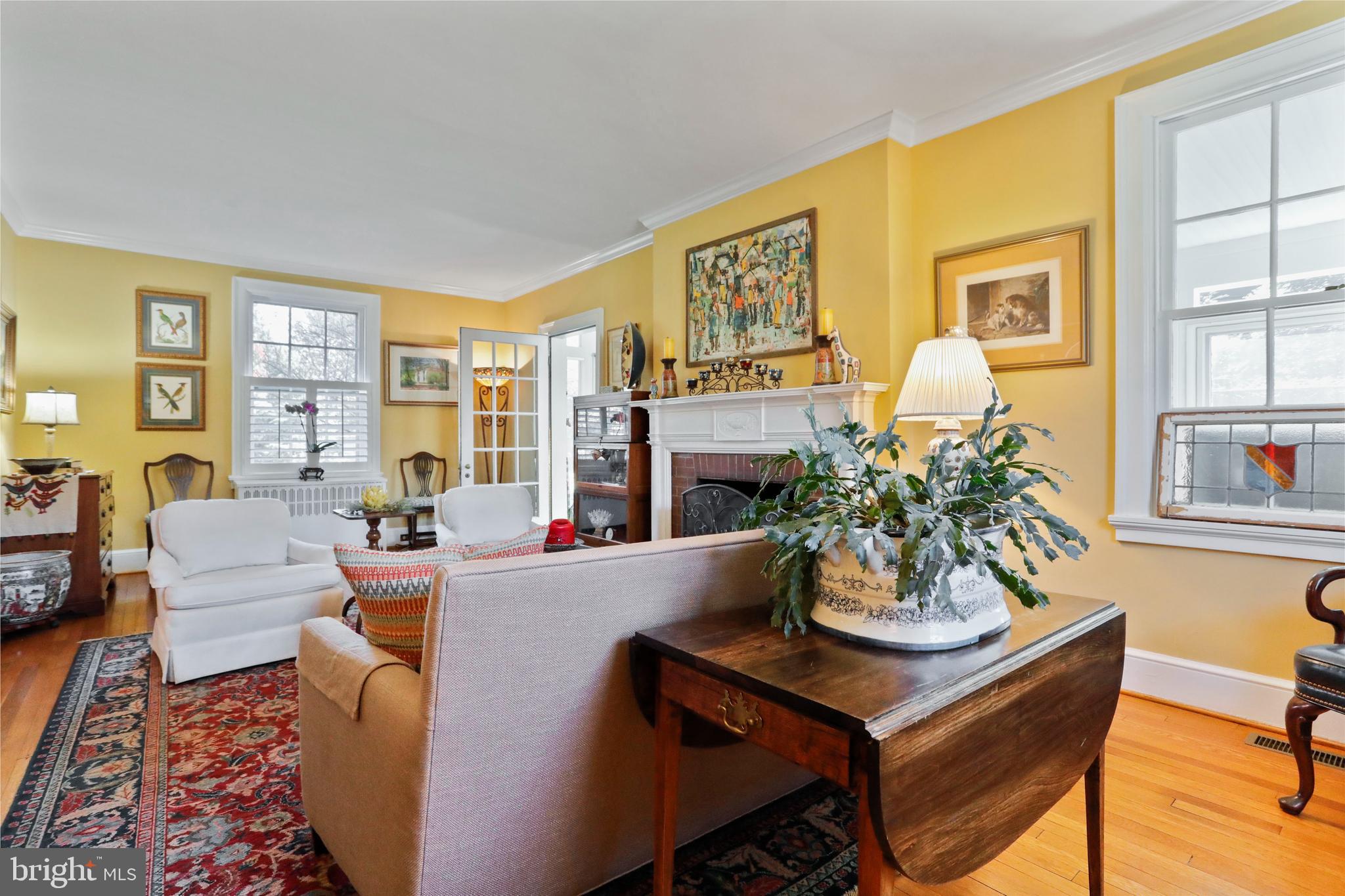 305 College Place Frederick, MD 21701 - Photo 11 of 71 a living room with fireplace furniture and a potted plant