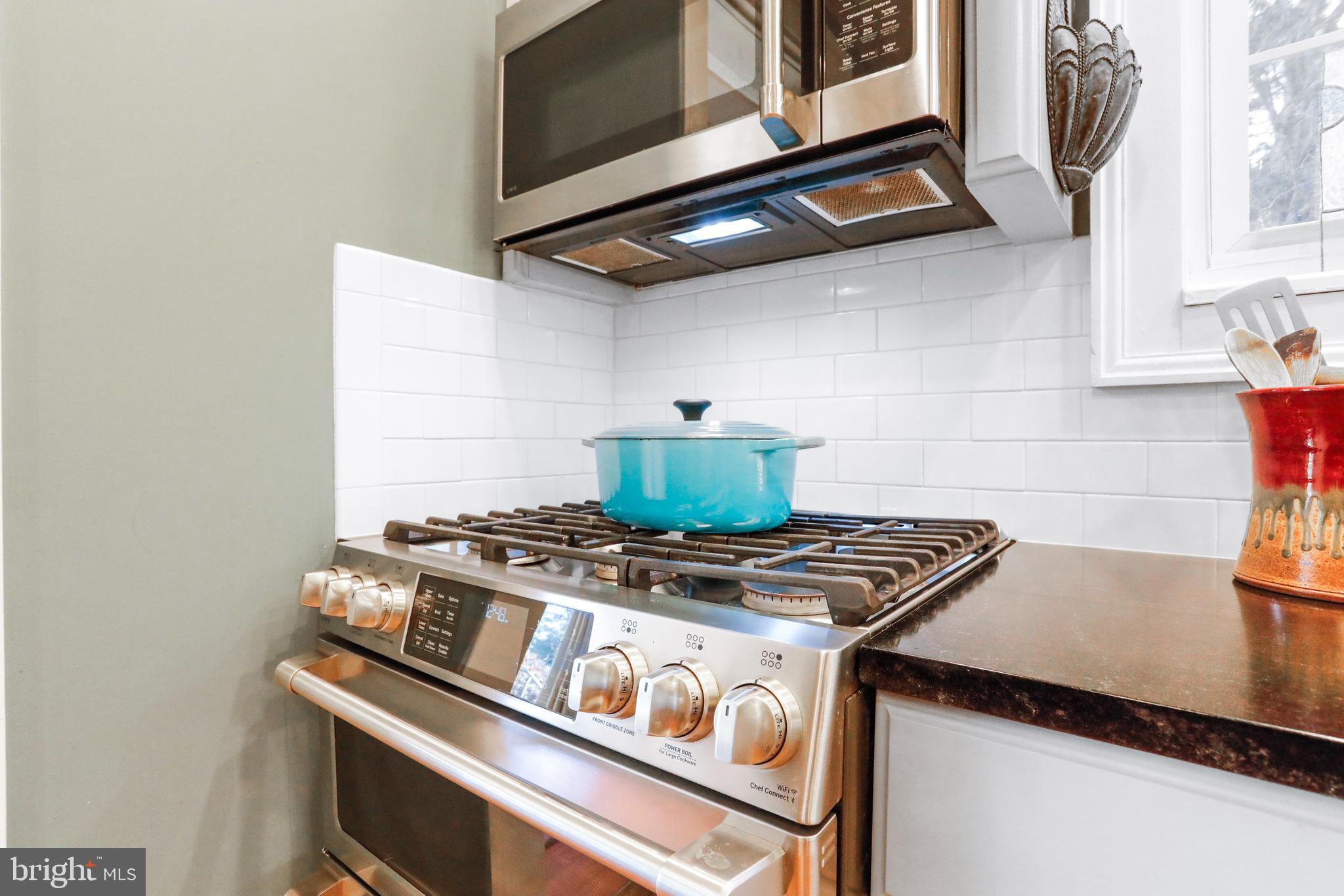 305 College Place Frederick, MD 21701 - Photo 18 of 71 a stove top oven sitting inside of a kitchen