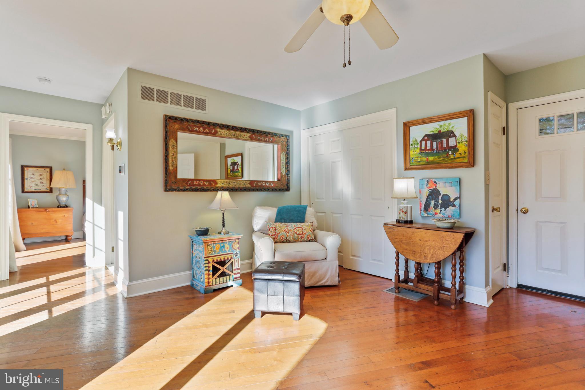 305 College Place Frederick, MD 21701 - Photo 20 of 71 a living room with furniture and a table