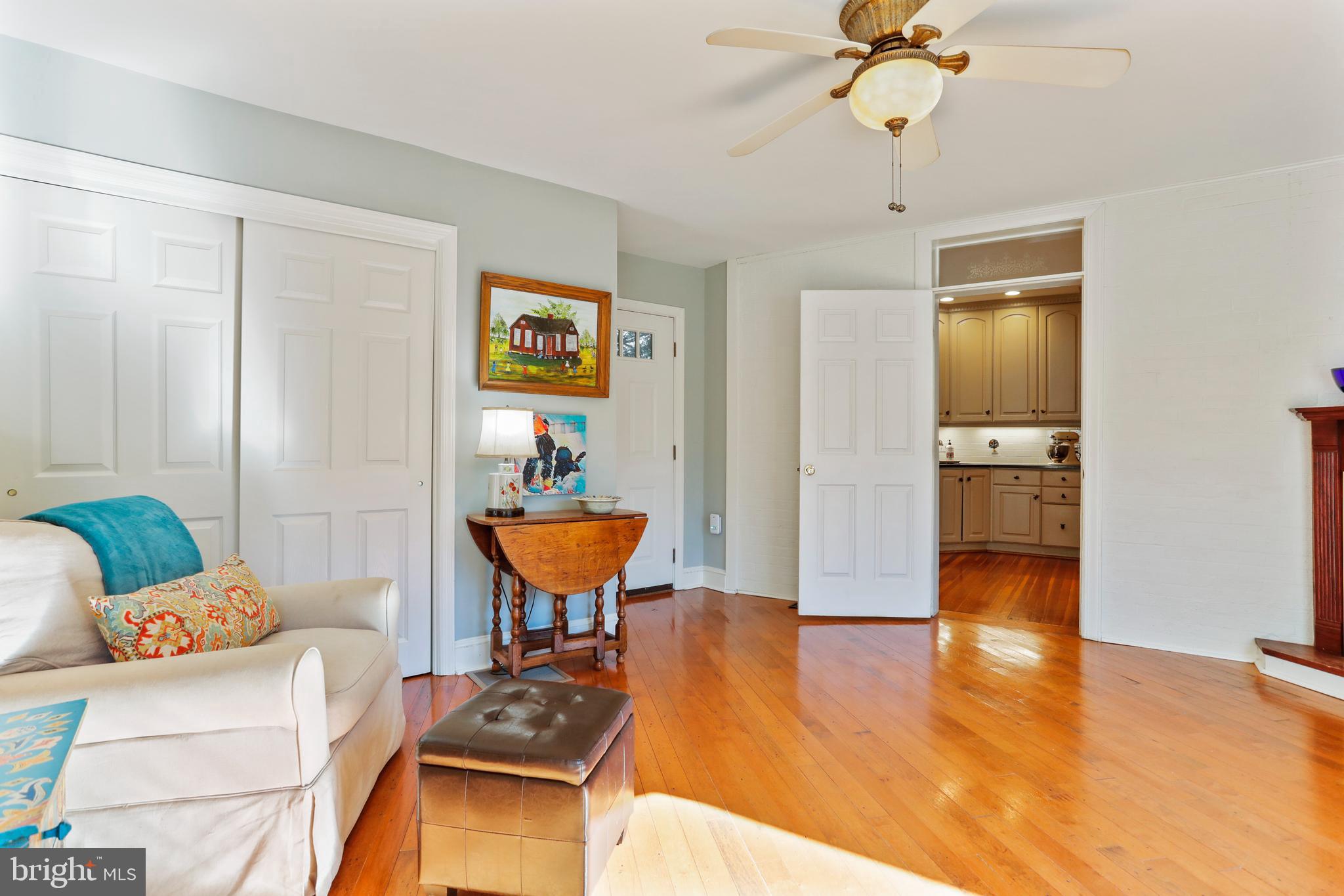 305 College Place Frederick, MD 21701 - Photo 21 of 71 a living room with furniture and a wooden floor