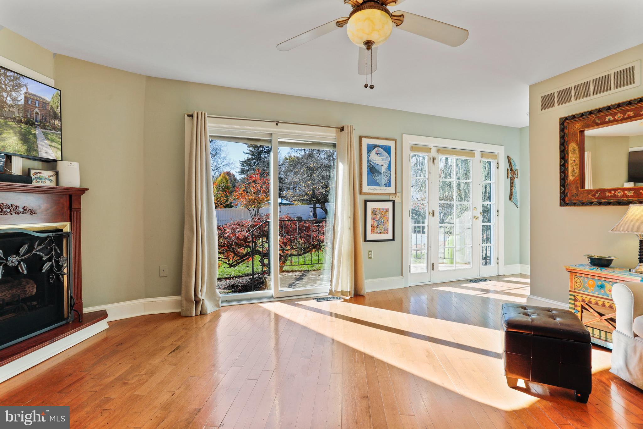 305 College Place Frederick, MD 21701 - Photo 22 of 71 a spacious bedroom with a large bed and a fireplace