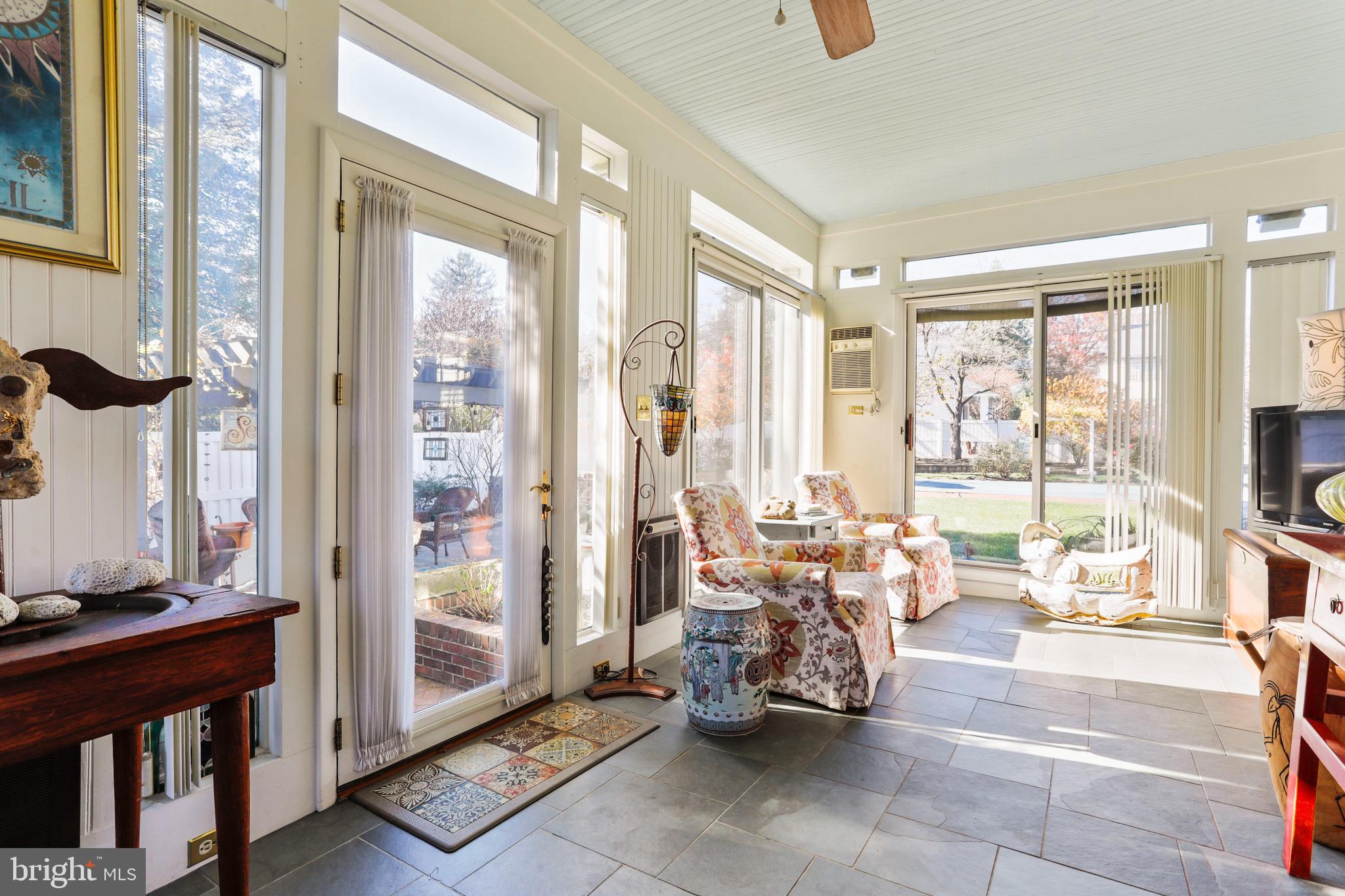 305 College Place Frederick, MD 21701 - Photo 23 of 71 a living room with furniture and floor to ceiling windows